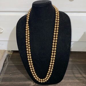 Long strands of beads . Easily can have 3 different lengths he and looks